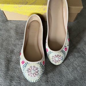 Multicolored flats; size 8.5; lightly worn but like new upper.